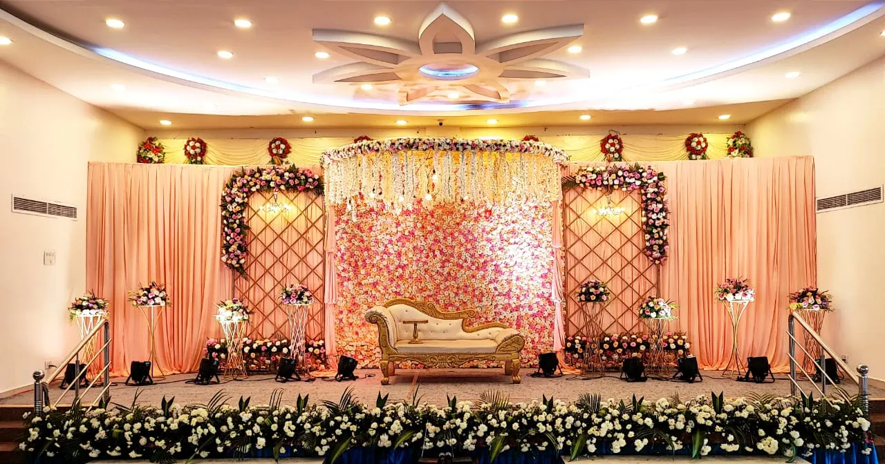 Stage with pink floral backdrop